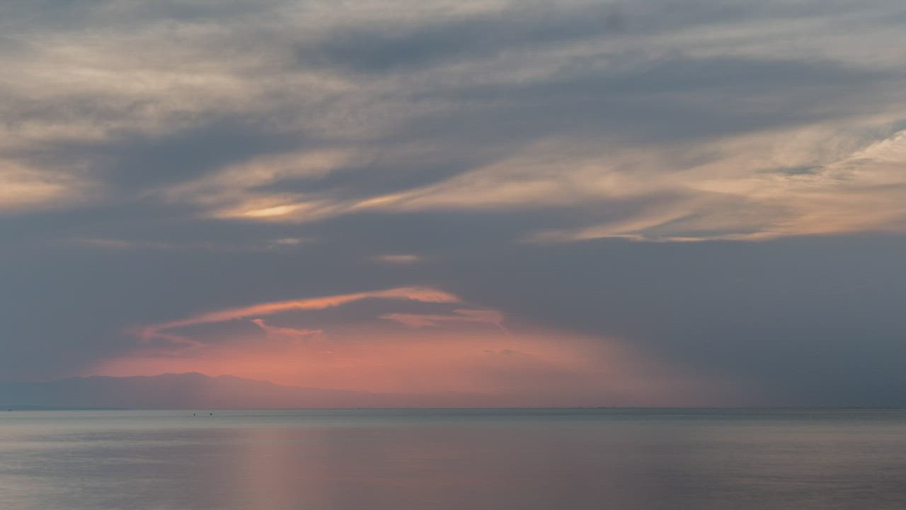 Sunset breaking through the clouds - Free Stock Video