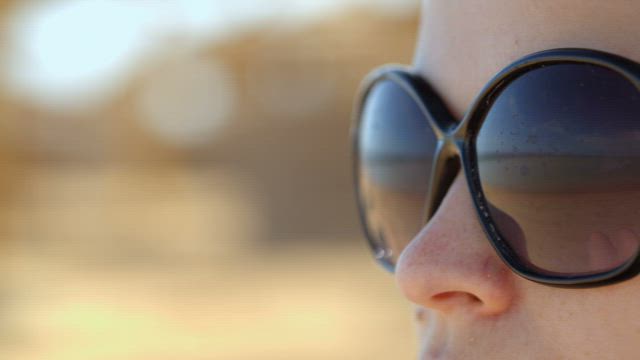 Woman with wide sunglasses.