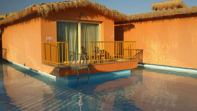 Vacation homes built around a pool.