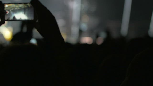 Recording the stage on a cellphone.