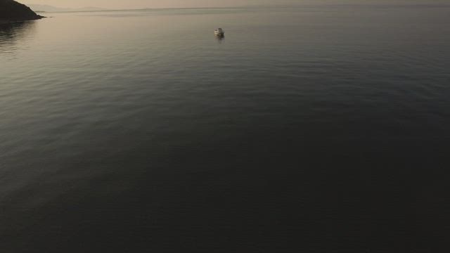 Empty boat anchored off the coast.