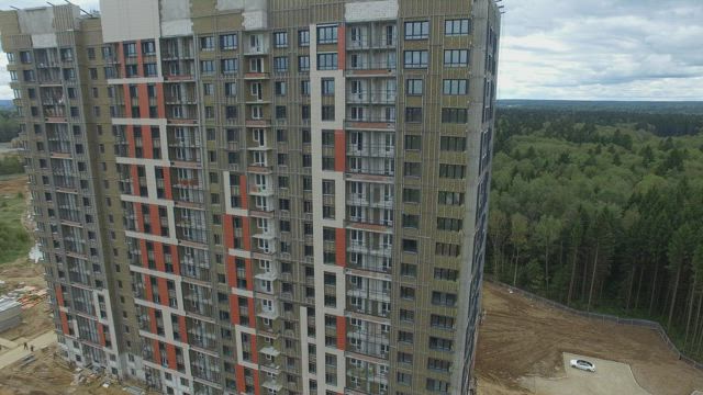 Apartments built at the edge of a city.