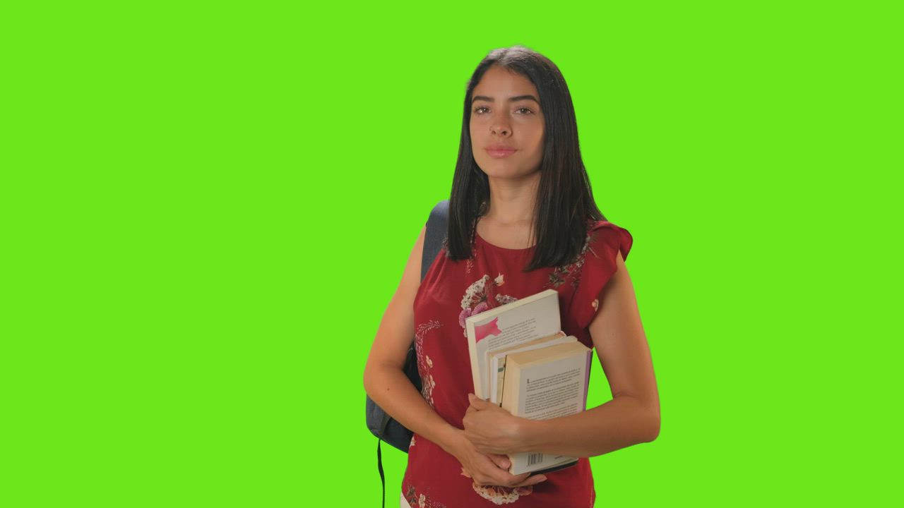 Student girl from the front smiling on a green background - Free Stock ...