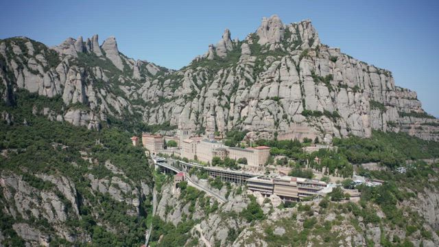 Abbey built into Montserrat Mountain.