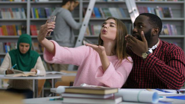 Students taking a photo instead of working.