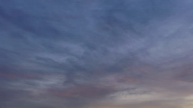 Zooming from clouds to skyline.