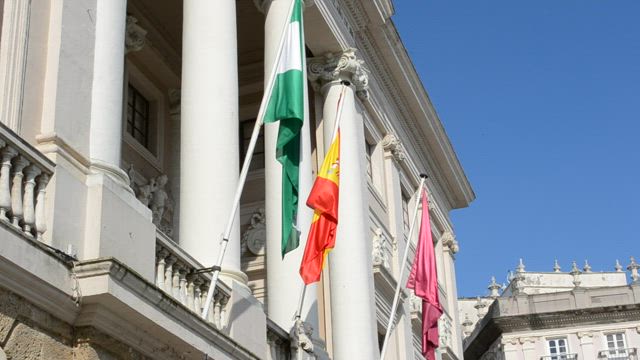 Flags outside of a building.