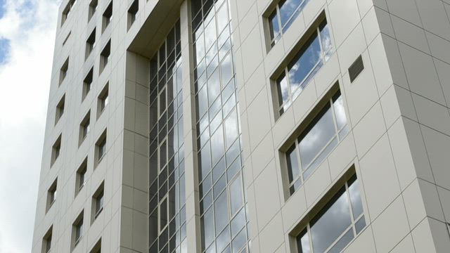 Clouds reflecting on office windows.