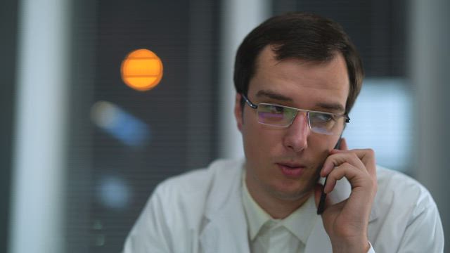 Dr. talking on the phone.