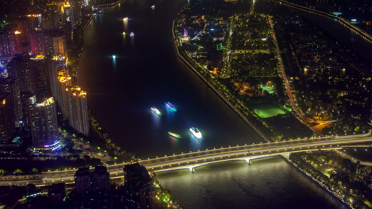 Aerial view of the river traffic by the city - Free Stock Video