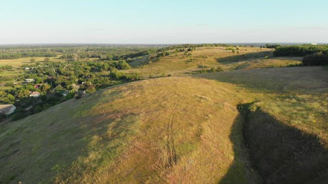 Flying over the greenfields in the morning.