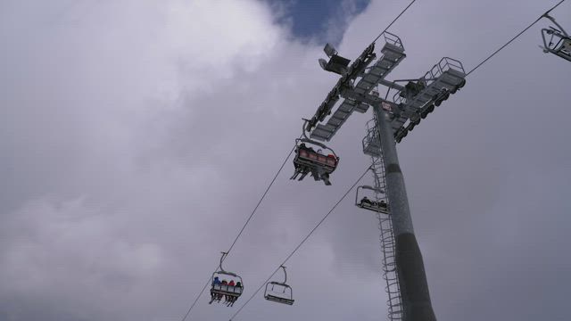 Zooming in at ski lift tower.