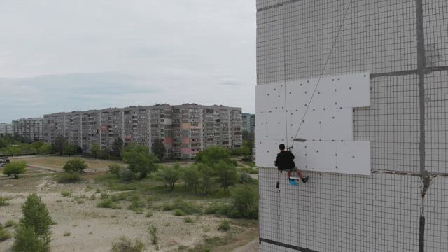Climber working on a building.