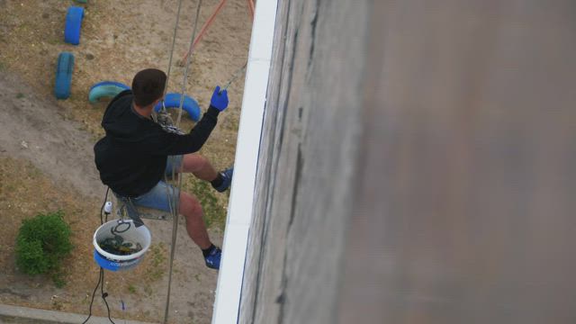 Climber working on building restoration.