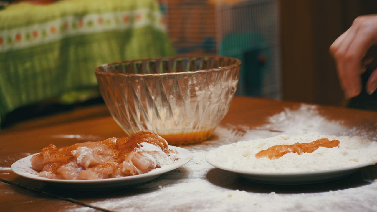 Meat breaded with flour - Free Stock Video