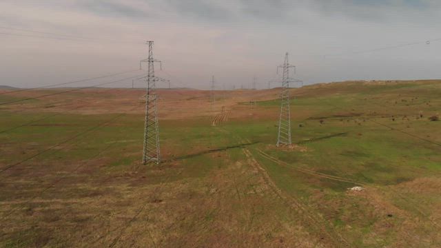 Electricity cable towers in the fields.