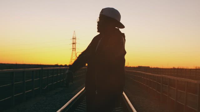 Silhouette of an urban dancer at sunset.