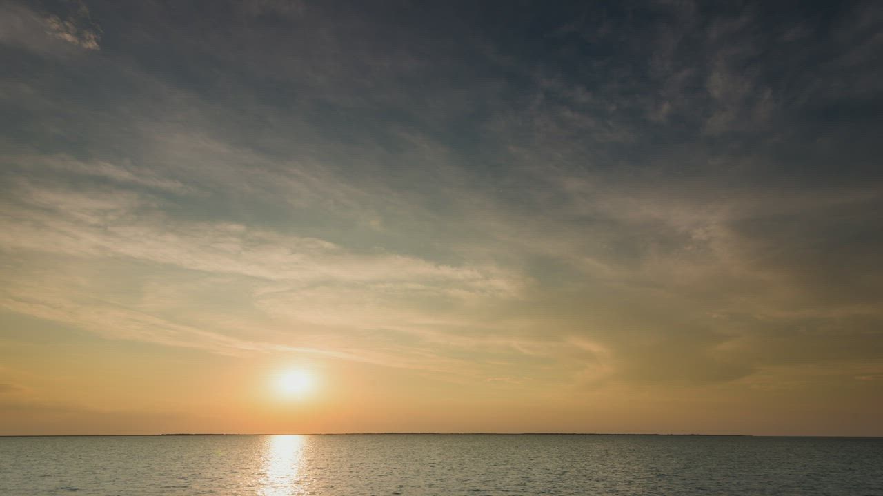 Time lapse of the sunrise before a storm at sea - Free Stock Video