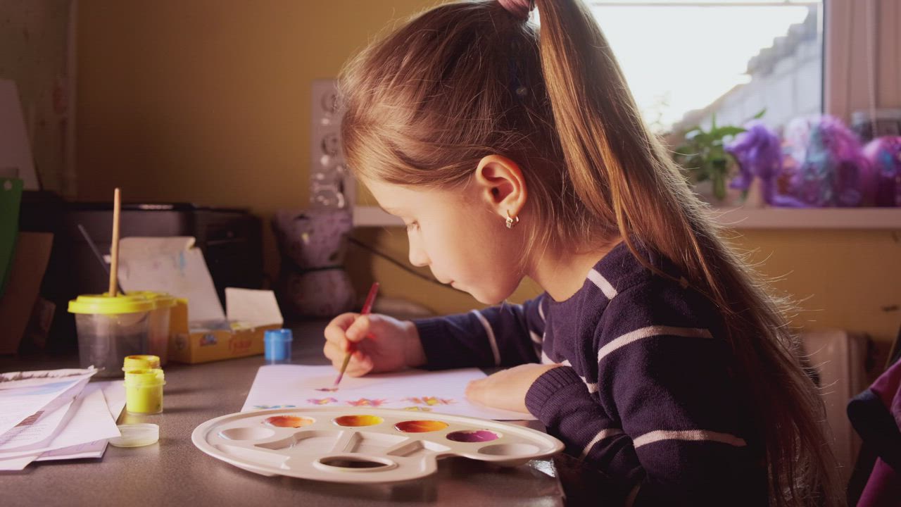Little girl painting at home - Free Stock Video