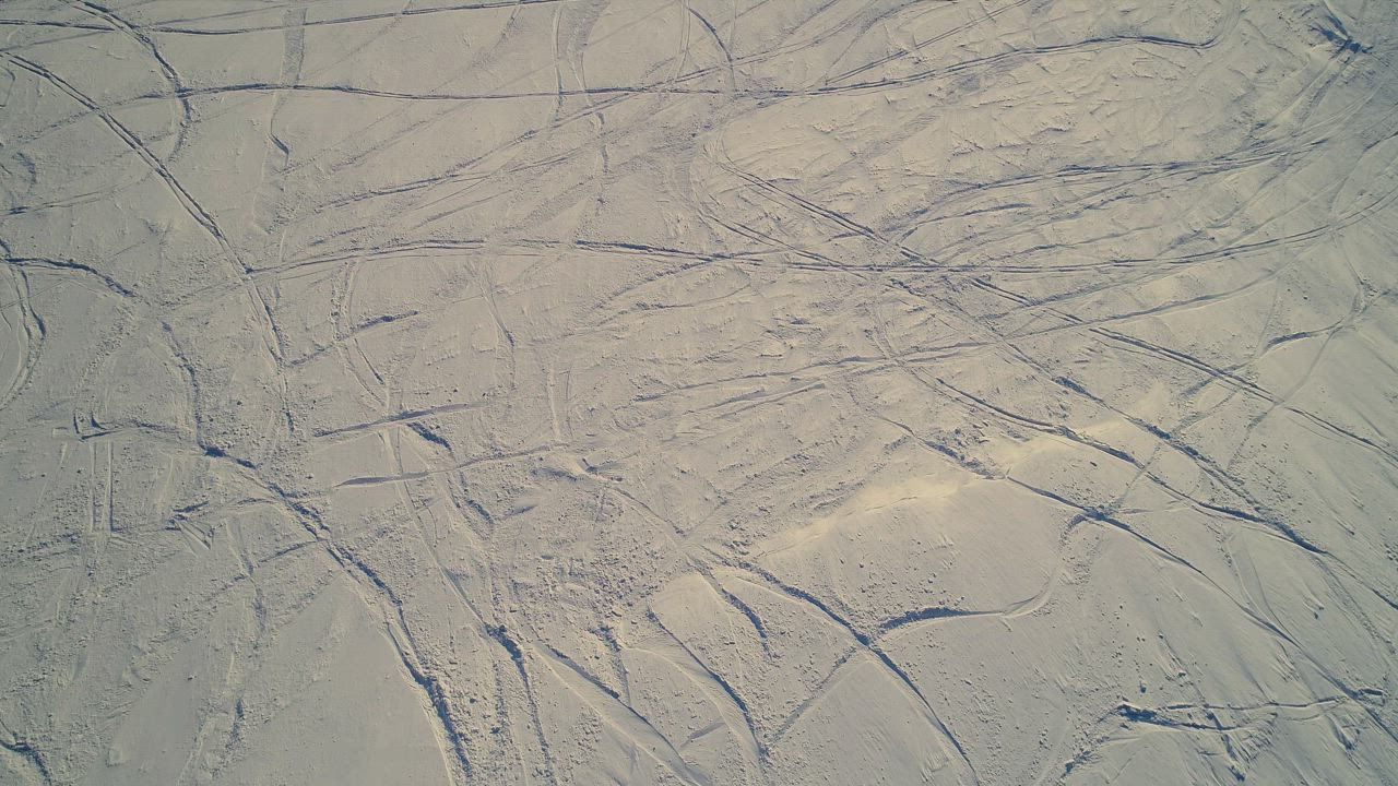 Ski tracks in the mountain snow - Free Stock Video