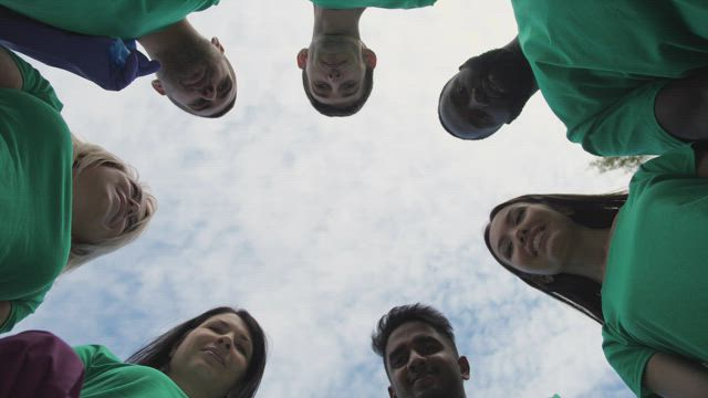 Hands in the middle of a work team.