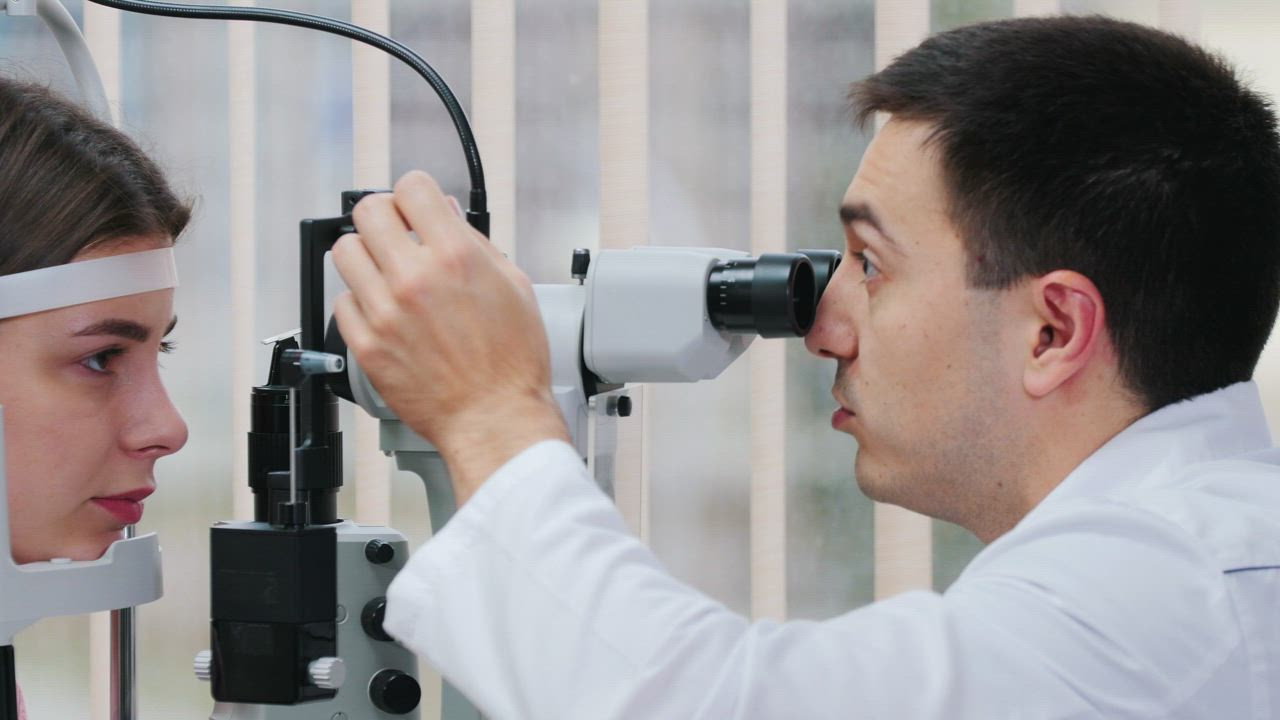 Young woman having an visual test with an optometrist - Free Stock Video