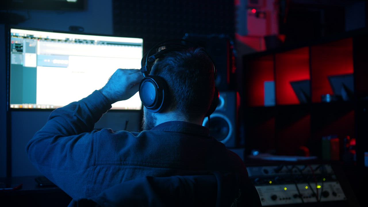 Sound engineer working at his recording studio - Free Stock Video