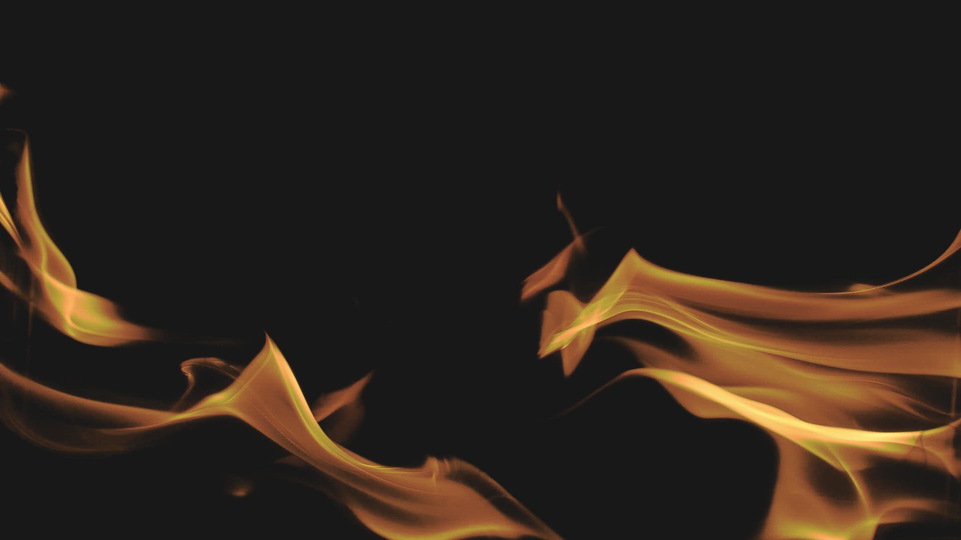 Flames curling across a black hearth