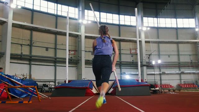 Female athlete training in pole vaulting.