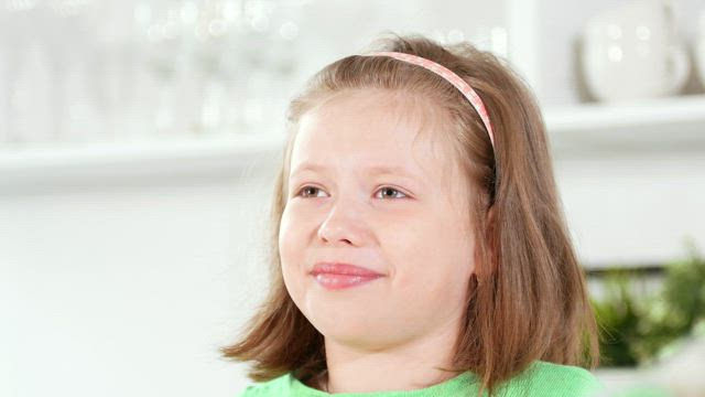 Portrait of a little girl laughing.