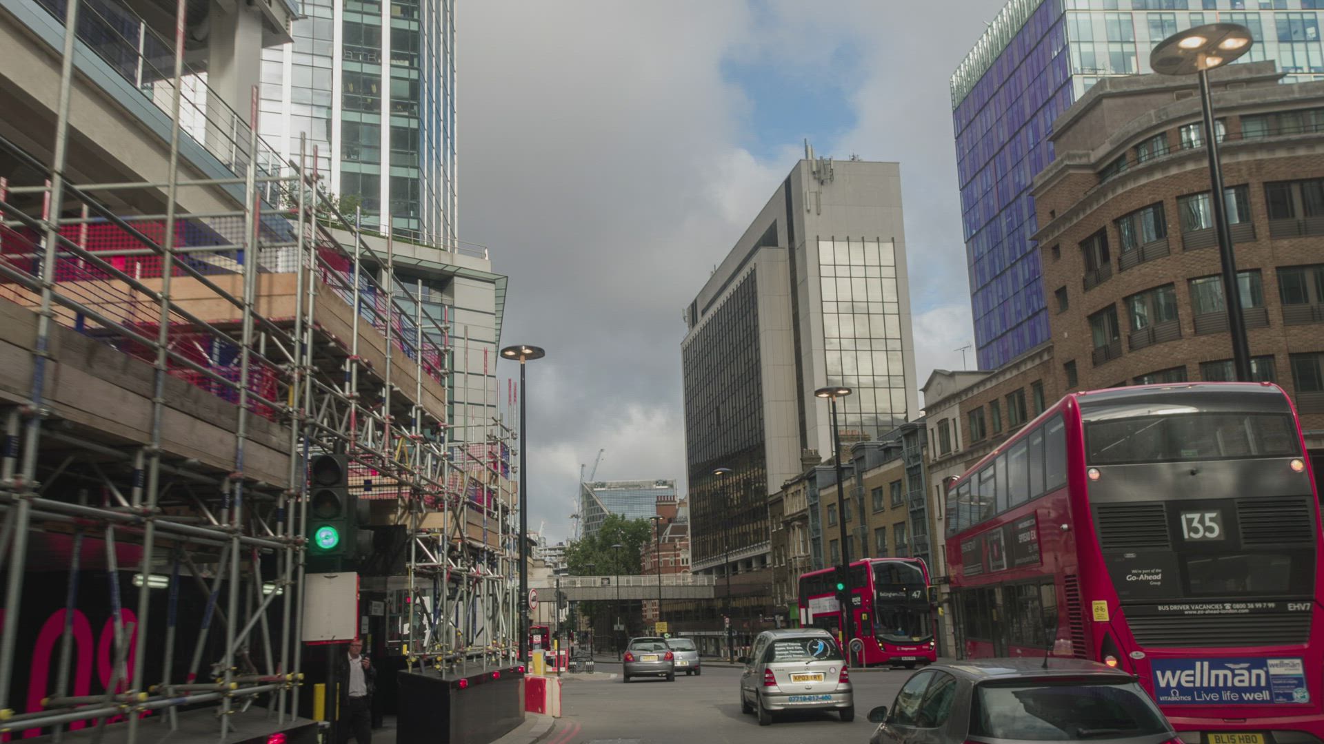 City of London street with a red double-decker bus, near Windermere Residences