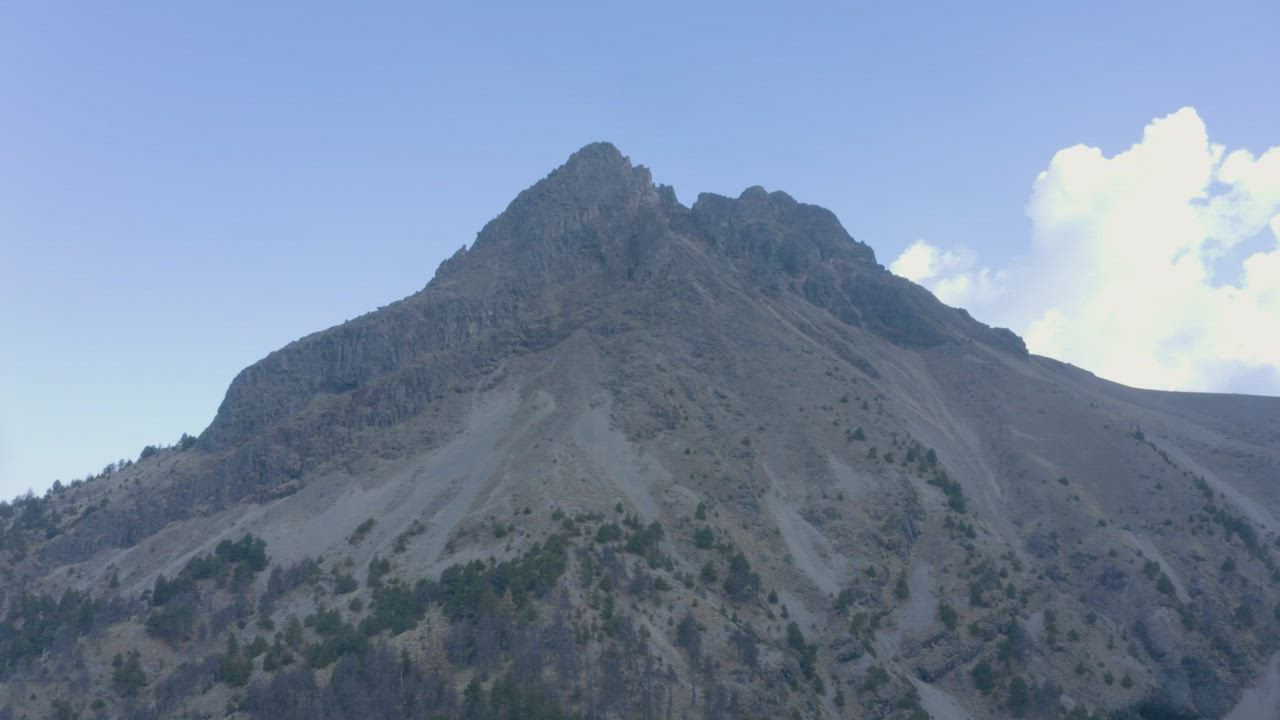 Zoom aerial shot of a rocky mountain - Free Stock Video