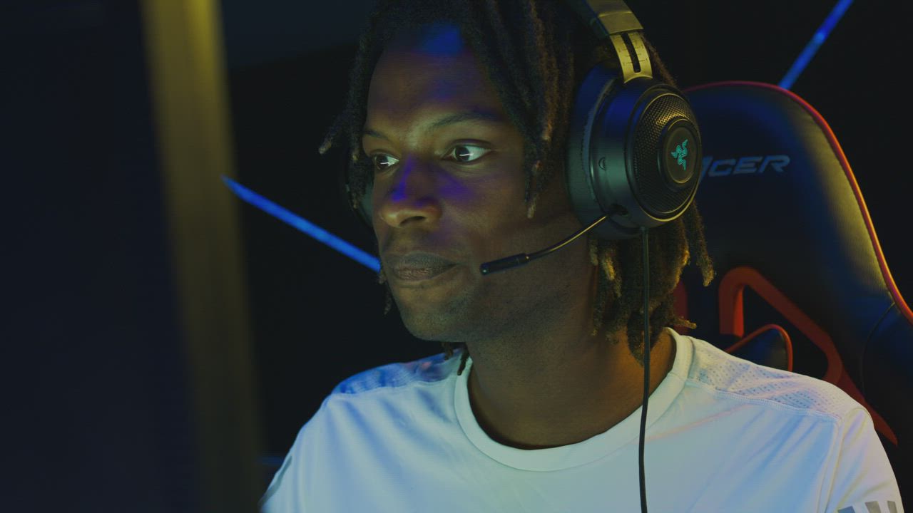 Face of a man playing on a gamer computer - Free Stock Video