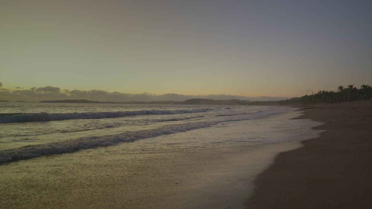 Pair of little girls on a beach at sunset - Free Stock Video