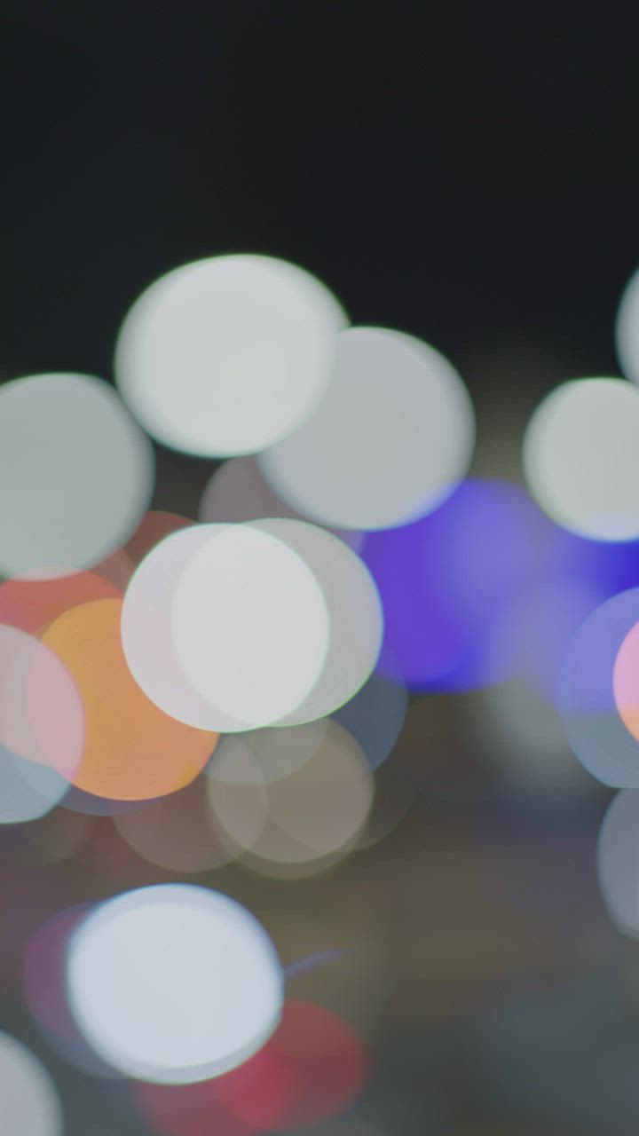 Lights of an avenue at night in a defocused shot - Free Stock Video