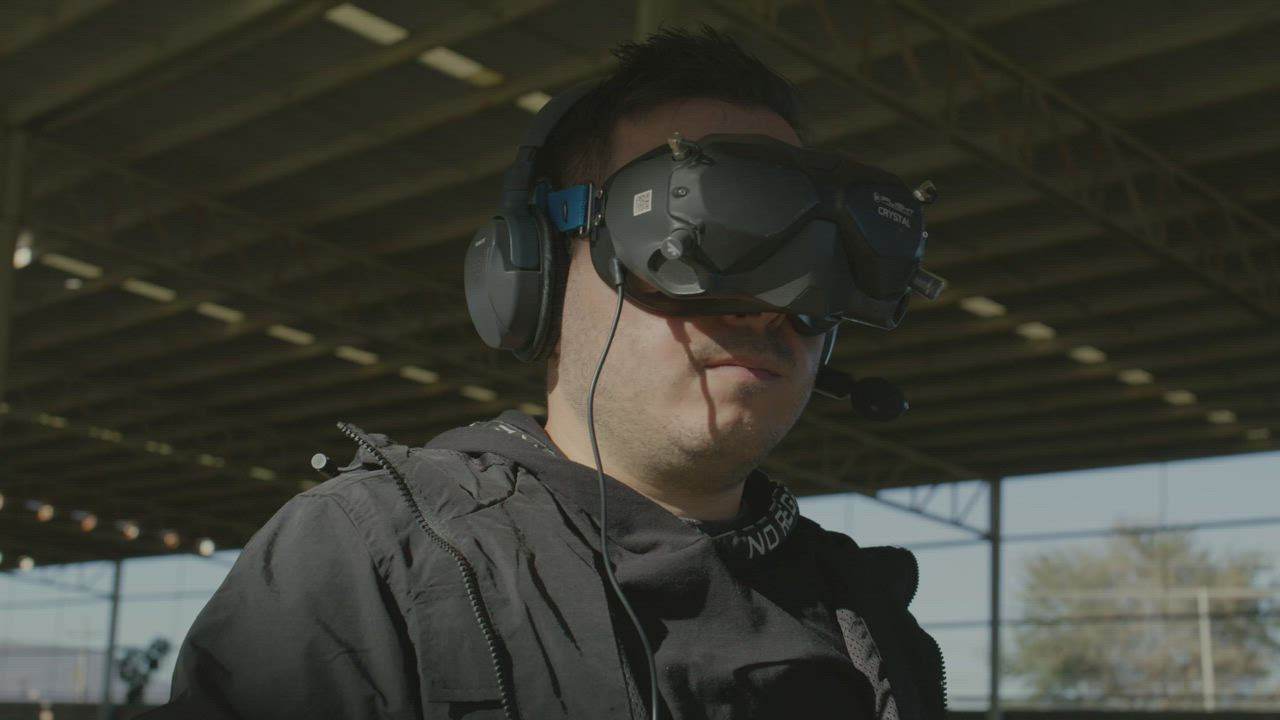 Man flying a drone with a controller and VR glasses - Free Stock Video