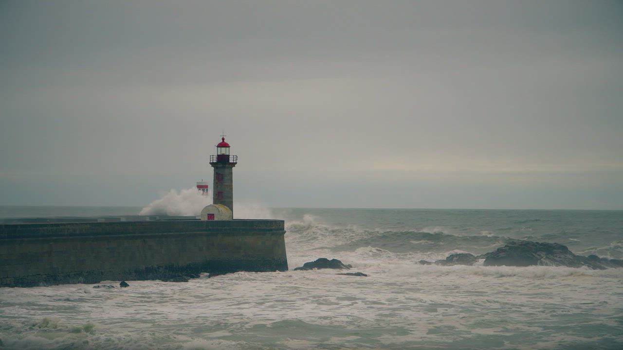 Large waves crashing on the shore as a storm brews out to sea - Free ...
