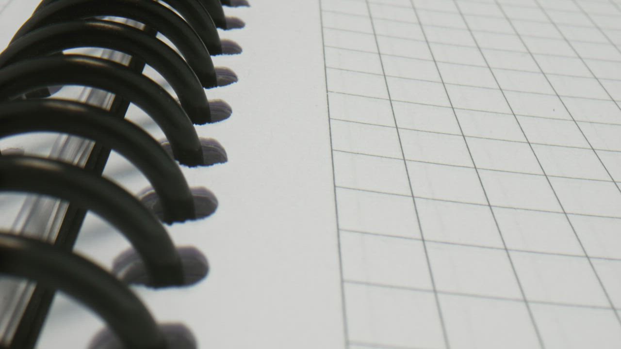 Close up of a spiral notebook spine Free Stock Video