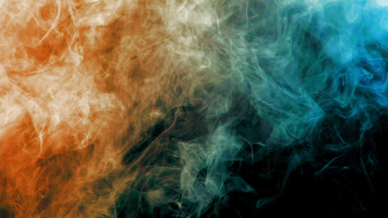 Orange and blue smoke on a black background - Free Stock Video