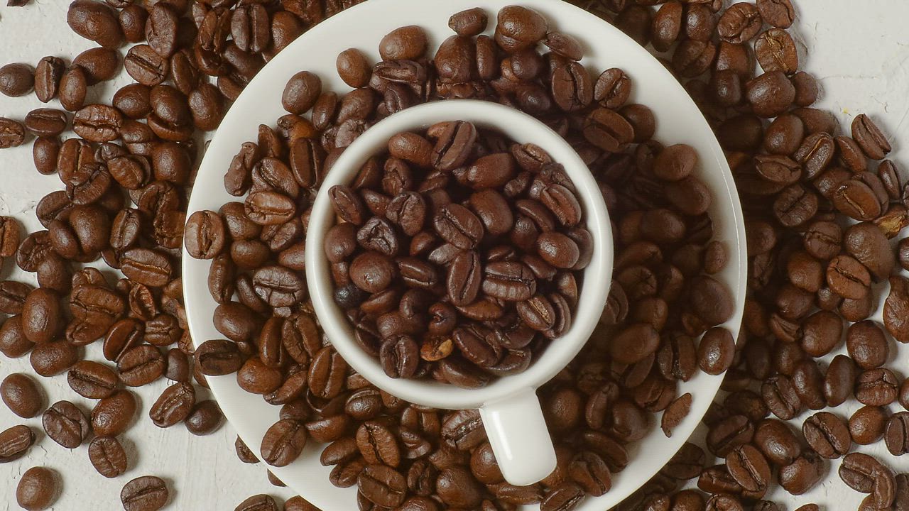 Birds eye view shot of a cup overfilled with fresh coffee beans - Free ...