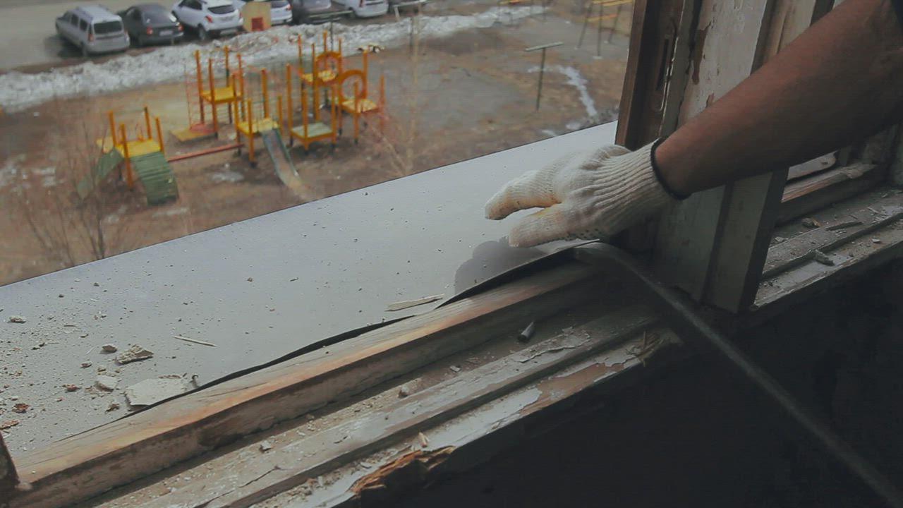 Construction worker dismantling old windows - Free Stock Video