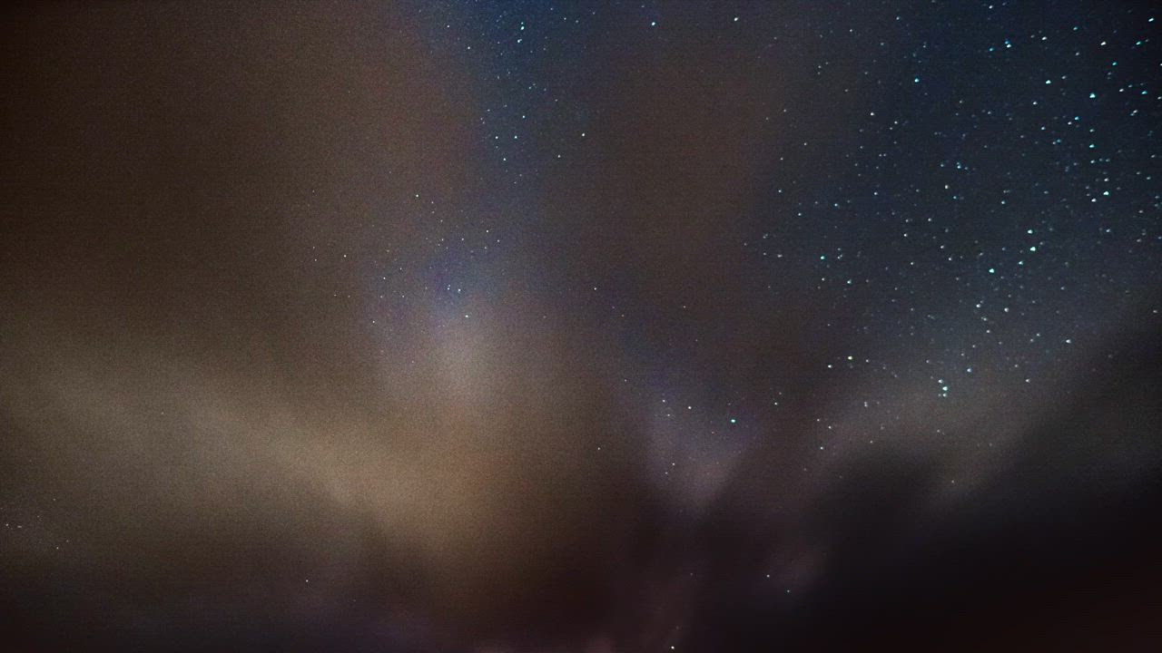 Milky way behind clouds - Free Stock Video