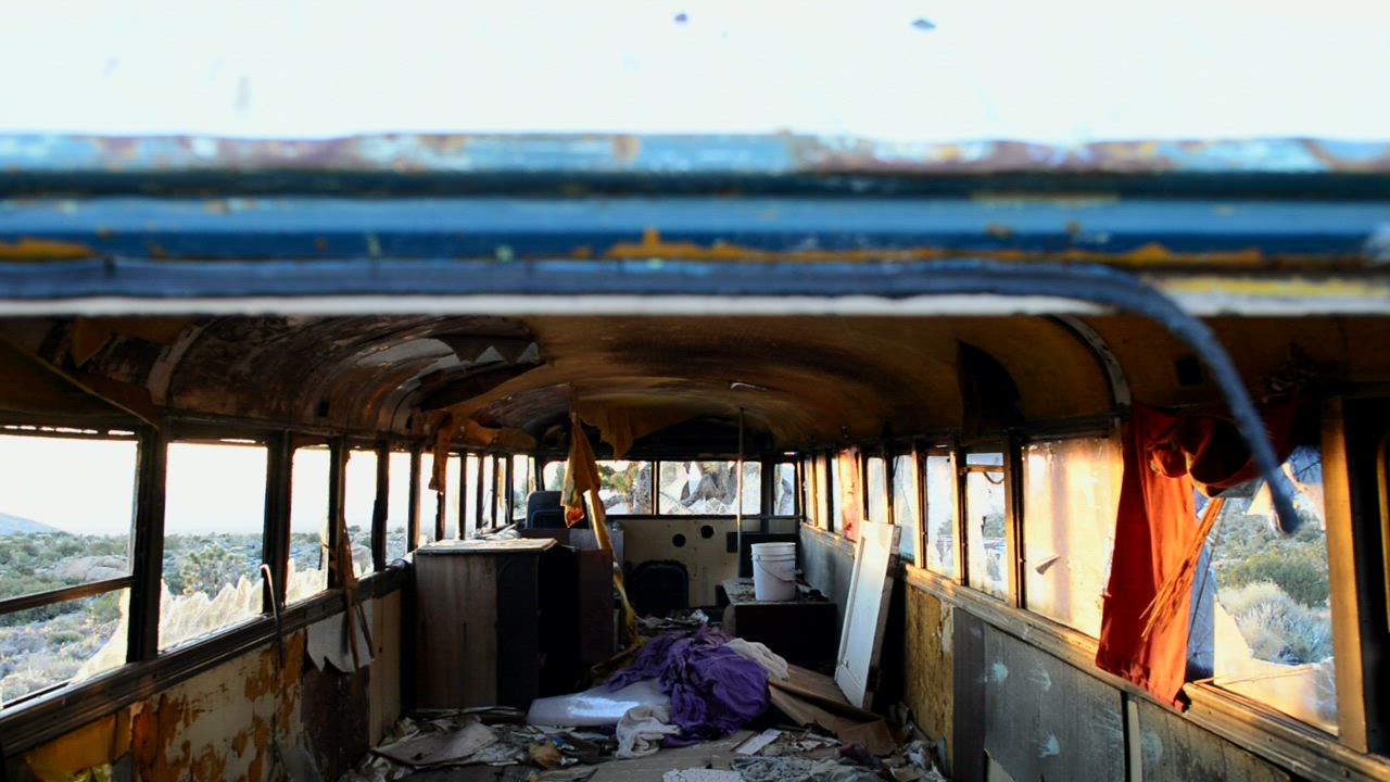Taking a look inside an abandoned rusty bus - Free Stock Video