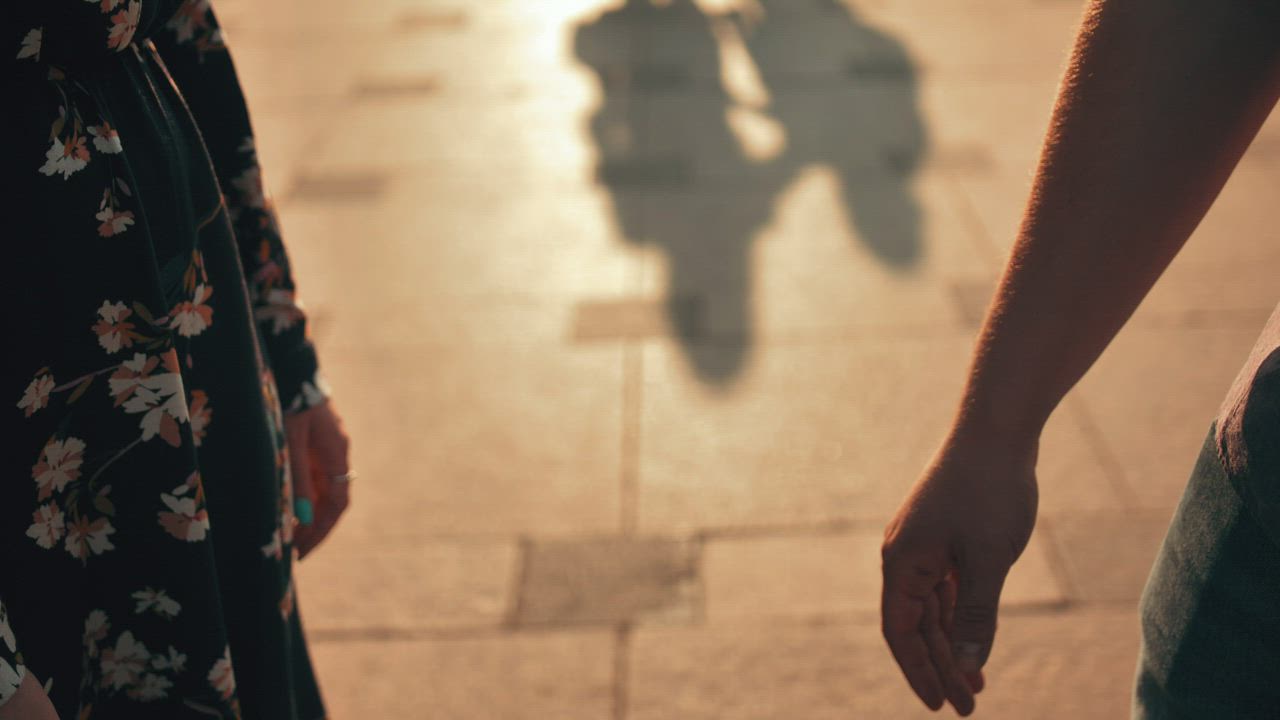 Couple holding hands in a walk - Free Stock Video