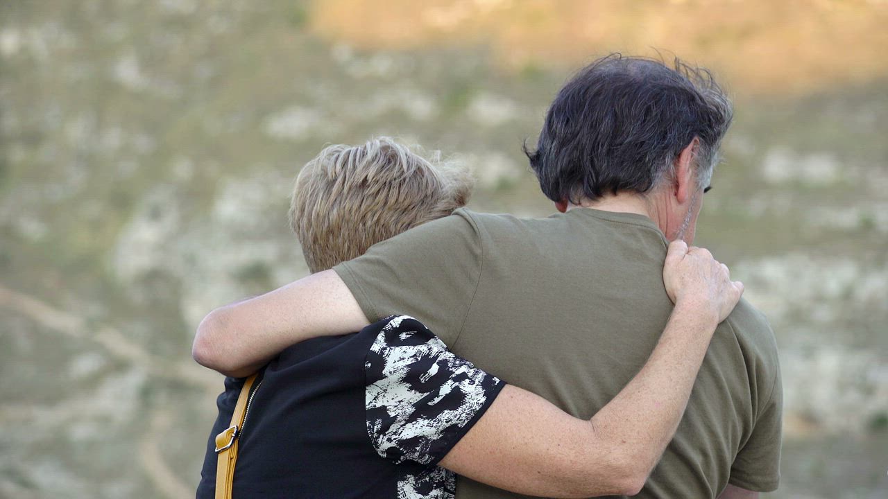 Couple hug while laughing or crying - Free Stock Video