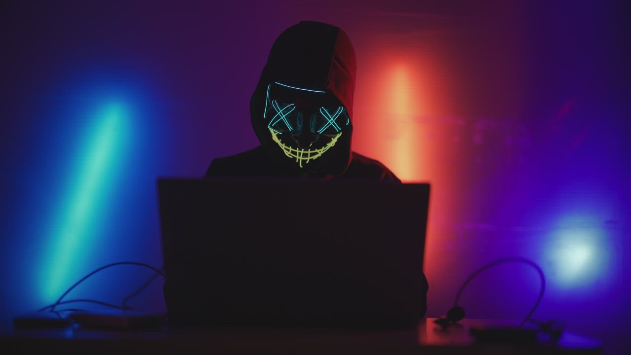 Hacker working on a laptop - Free Stock Video