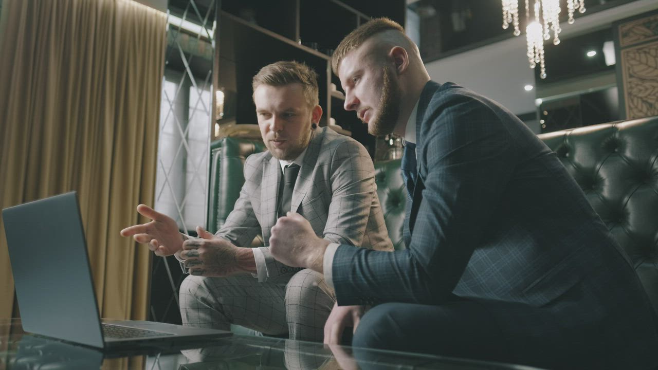 Business executives discussing a merger deal