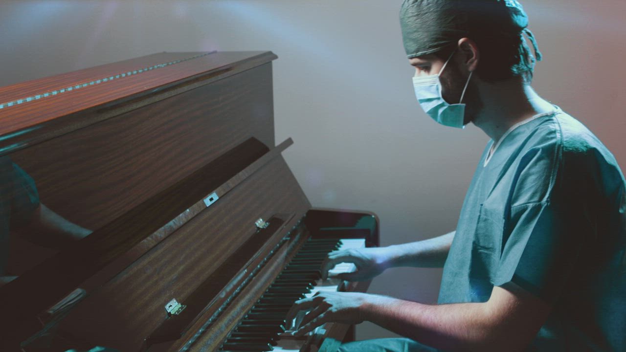 Doctor plays piano after a long day at work - Free Stock Video