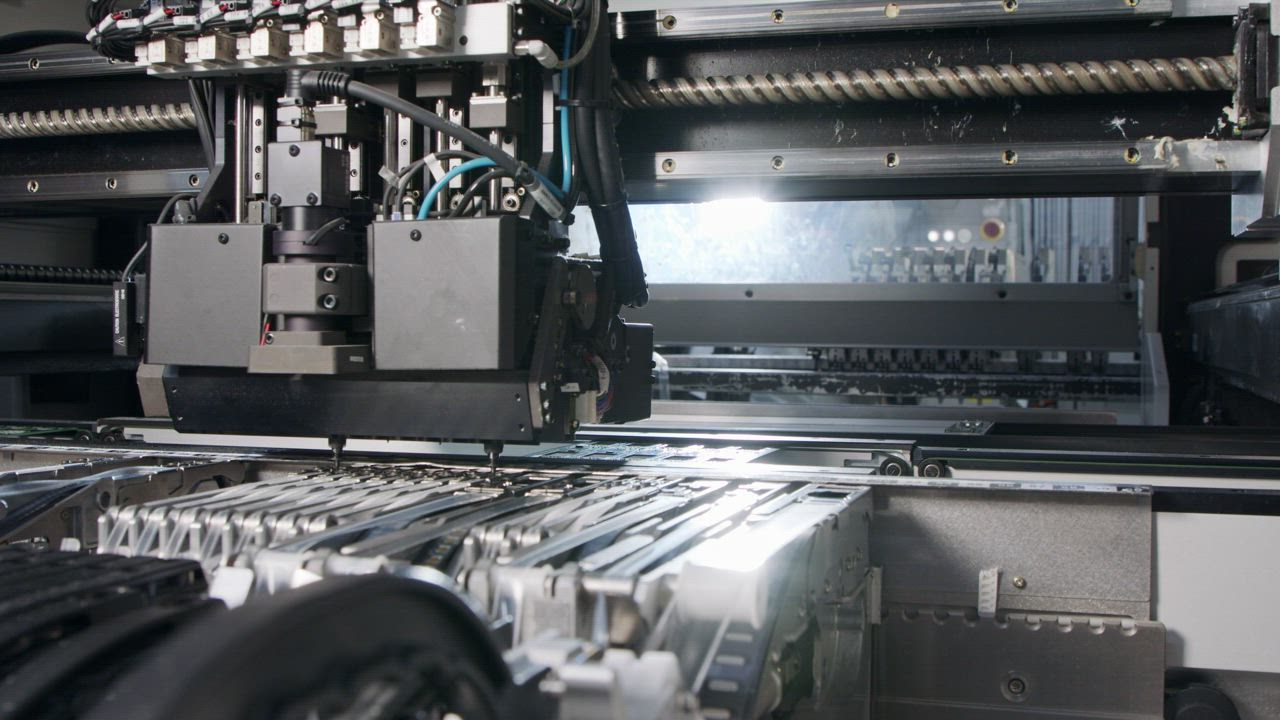 Automated machine places parts on circuit boards - Free Stock Video