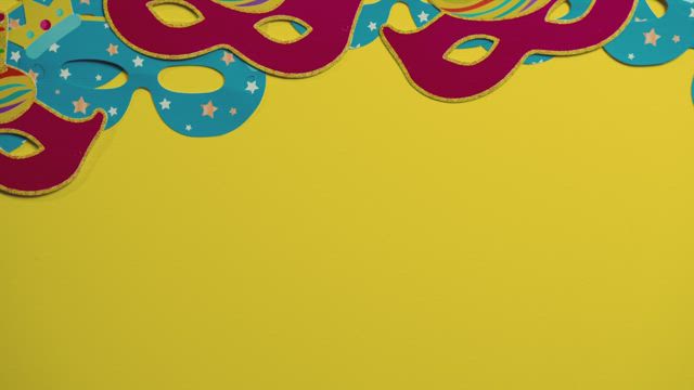 Festive yellow background with Mardi Gras masks.